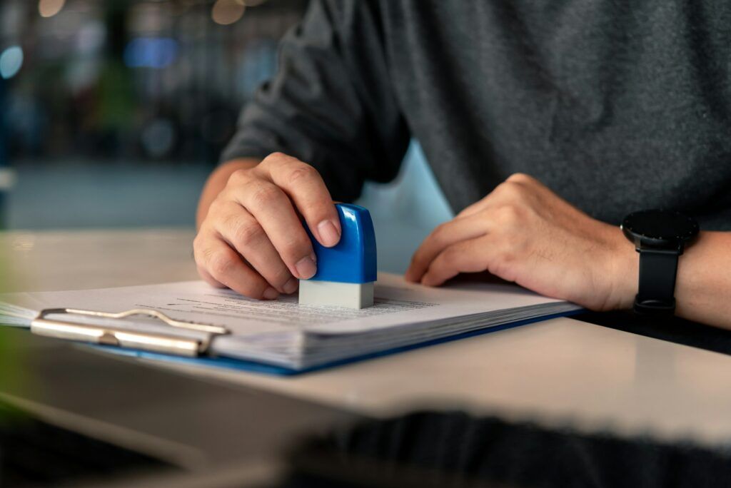 Contract law or paper work business and finance document rubber stamp.